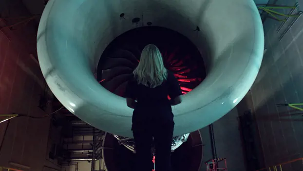 Female engineering production manager, next to an aircraft engine