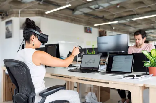 Female design engineer tests virtual reality software