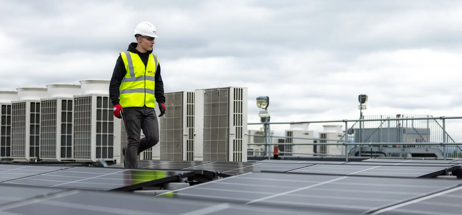 Engineer inspecting solar panels.