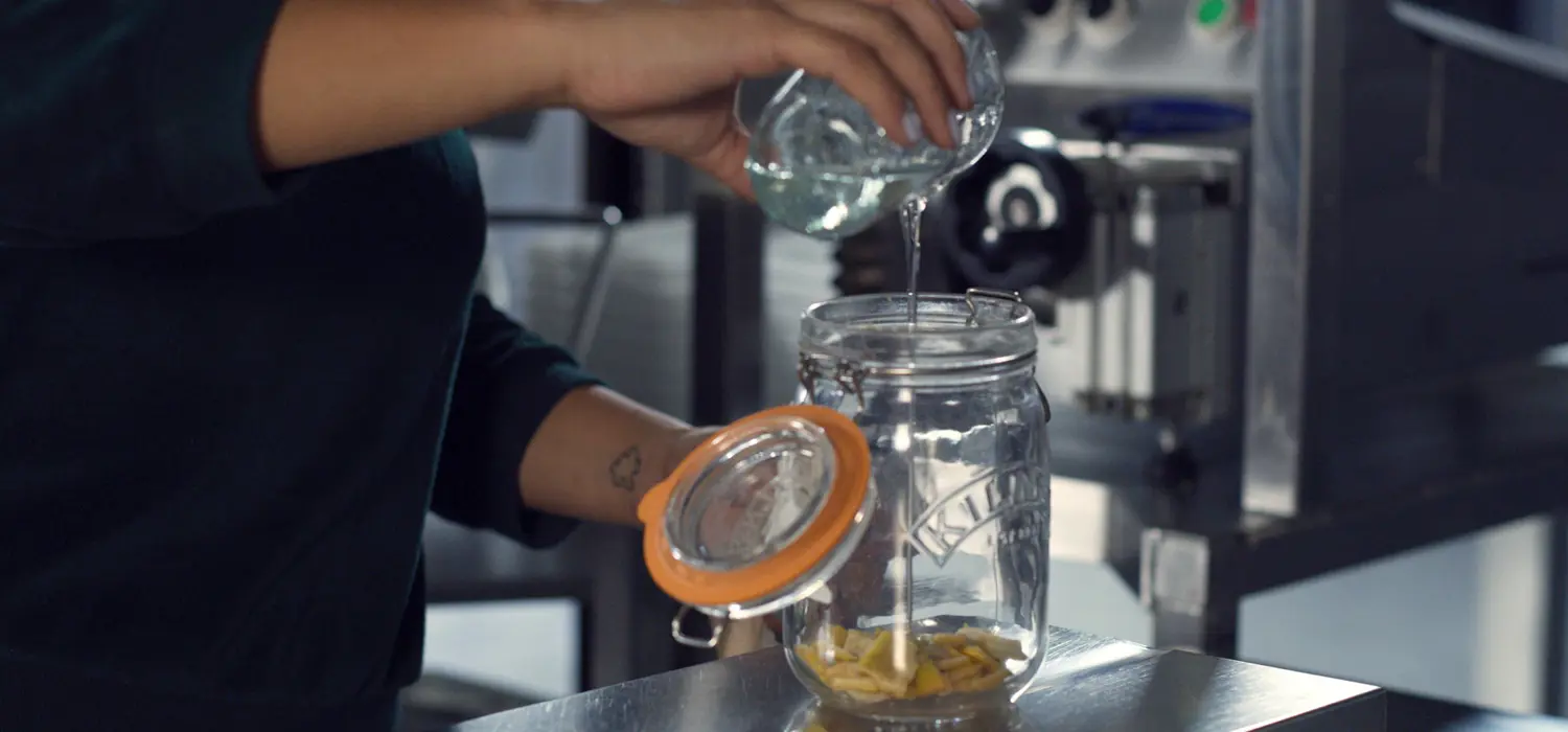 Chemical engineer mixes chemicals in a workshop