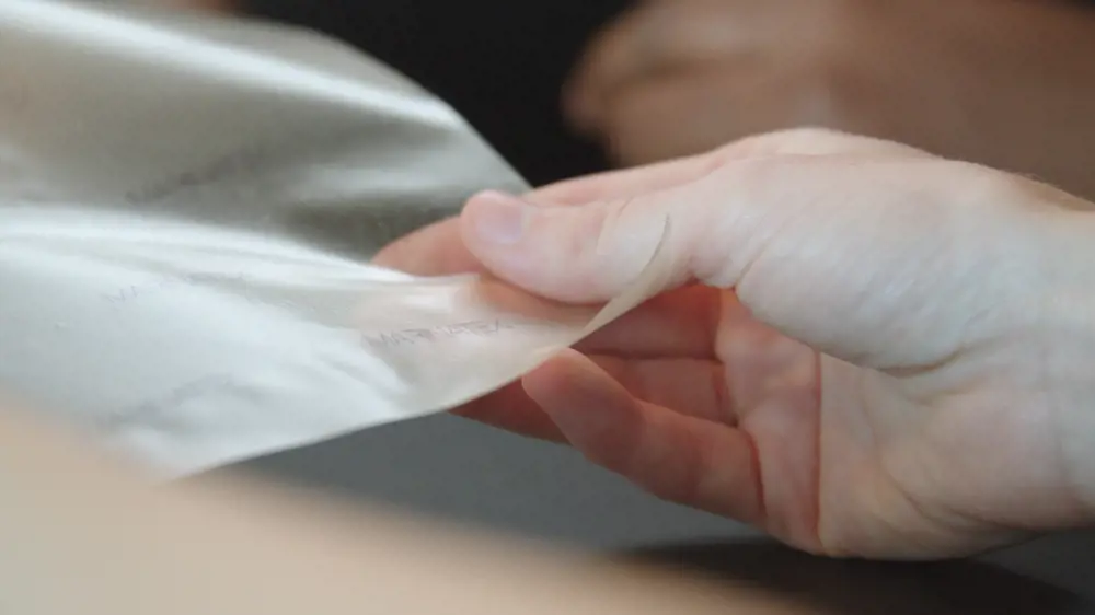 Engineer examining biodegradable plastic alternative