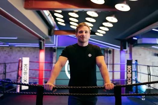 Male mechanical engineer in boxing ring